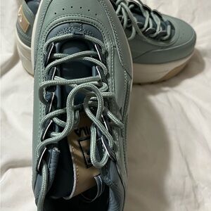 Fila Lace-Up Trainer in Sage and Cream with Tan Accent.